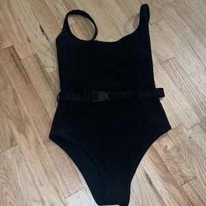 Off white one piece black swimsuit with belt